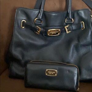 Black leather shoulder bag with matching wallet